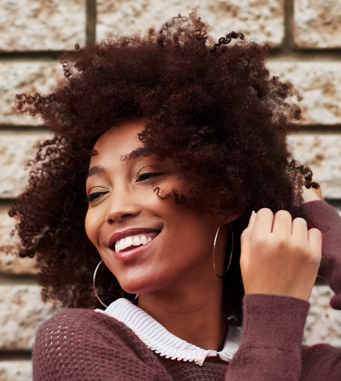 Happy woman with curly hair